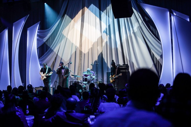 Band performing on stage in front of an audience