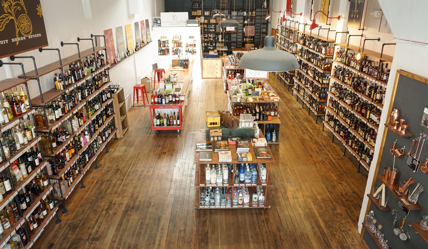 bottles of liquor on shelves, wooden floors