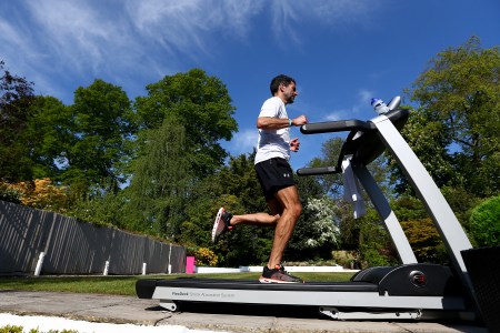 A man running on a treadmill. Interested in the 12-3-30 treadmill workout? Let's take a look at it.