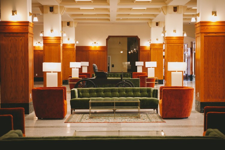 Lobby with brown and green decor accents in the Crazy Water Hotel