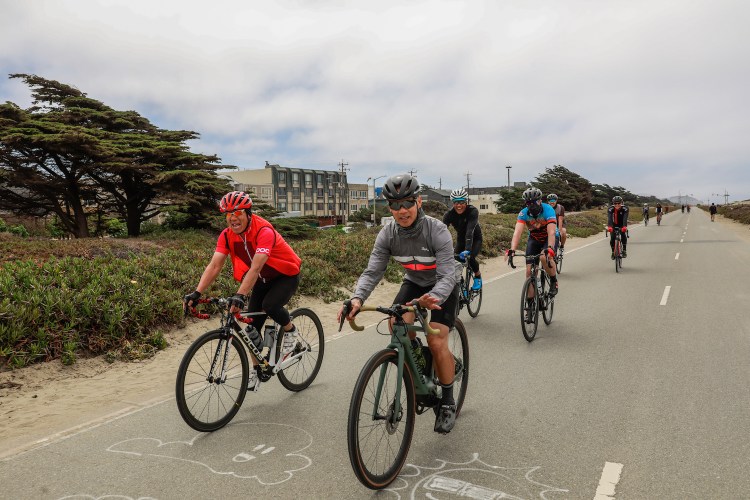 Cyclists ride their bikes on Great Highway