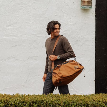 a model wearing wills clothing on holding a bag