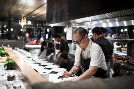 Chef Jeremiah Stone cooking at the Impression Makers Supper Club Series