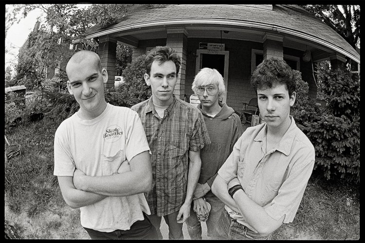 Band members from Minor Threat posing for photographer Glen E. Friedman