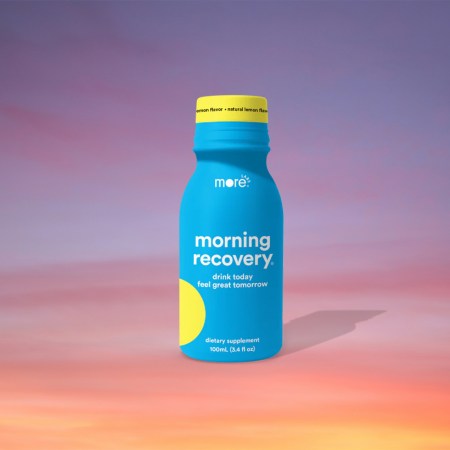 A bottle of Morning Recovery from More Labs against a sunrise background. Is it a hangover cure? We tested it.