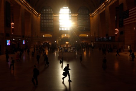 A man power-walking through Grand Central during his commute.