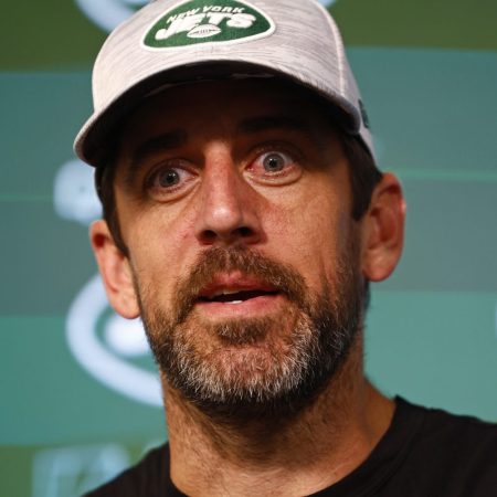 Aaron Rodgers talks to reporters in June.