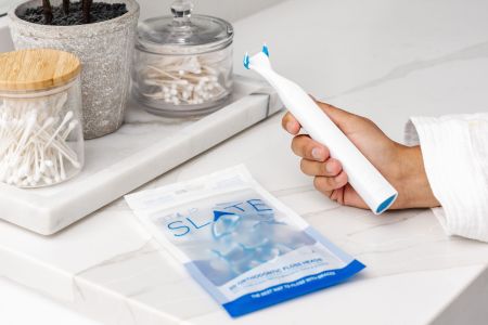 The Slate Electric Flosser, a flossing device we tested and reviewed