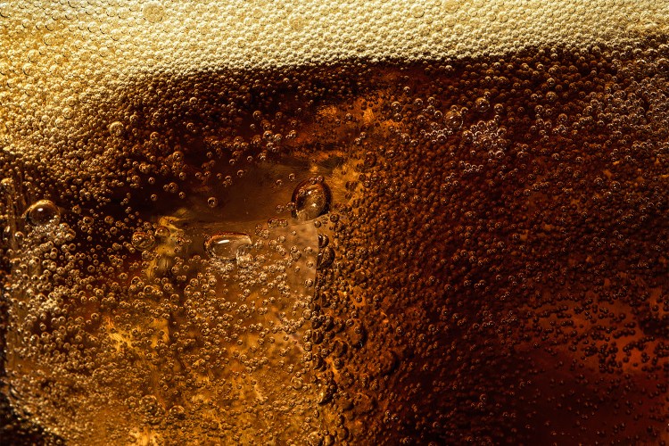 A close-up of carbonation in soda. We take a look at gut-health sodas like Poppi, Olipop and Culture Pop to see if they're actually good for you.