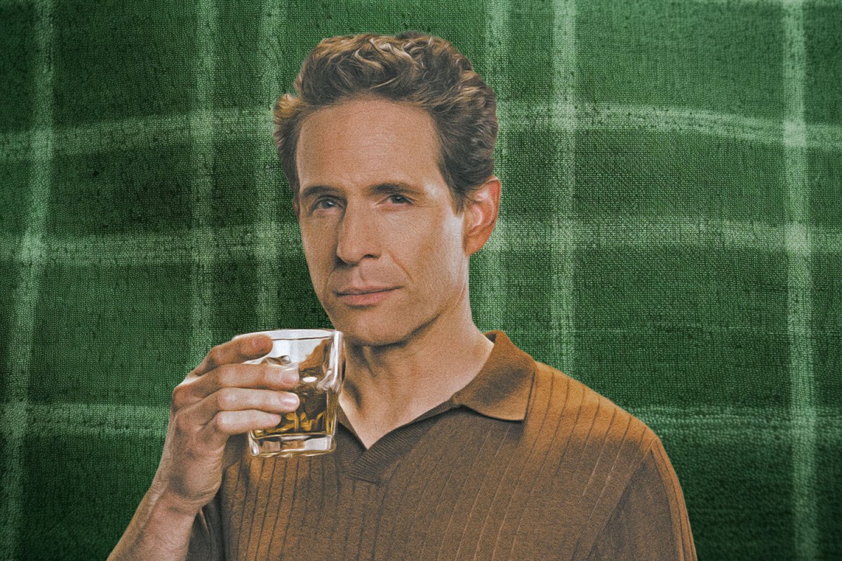 Glenn Howerton holding some Four Walls whiskey.