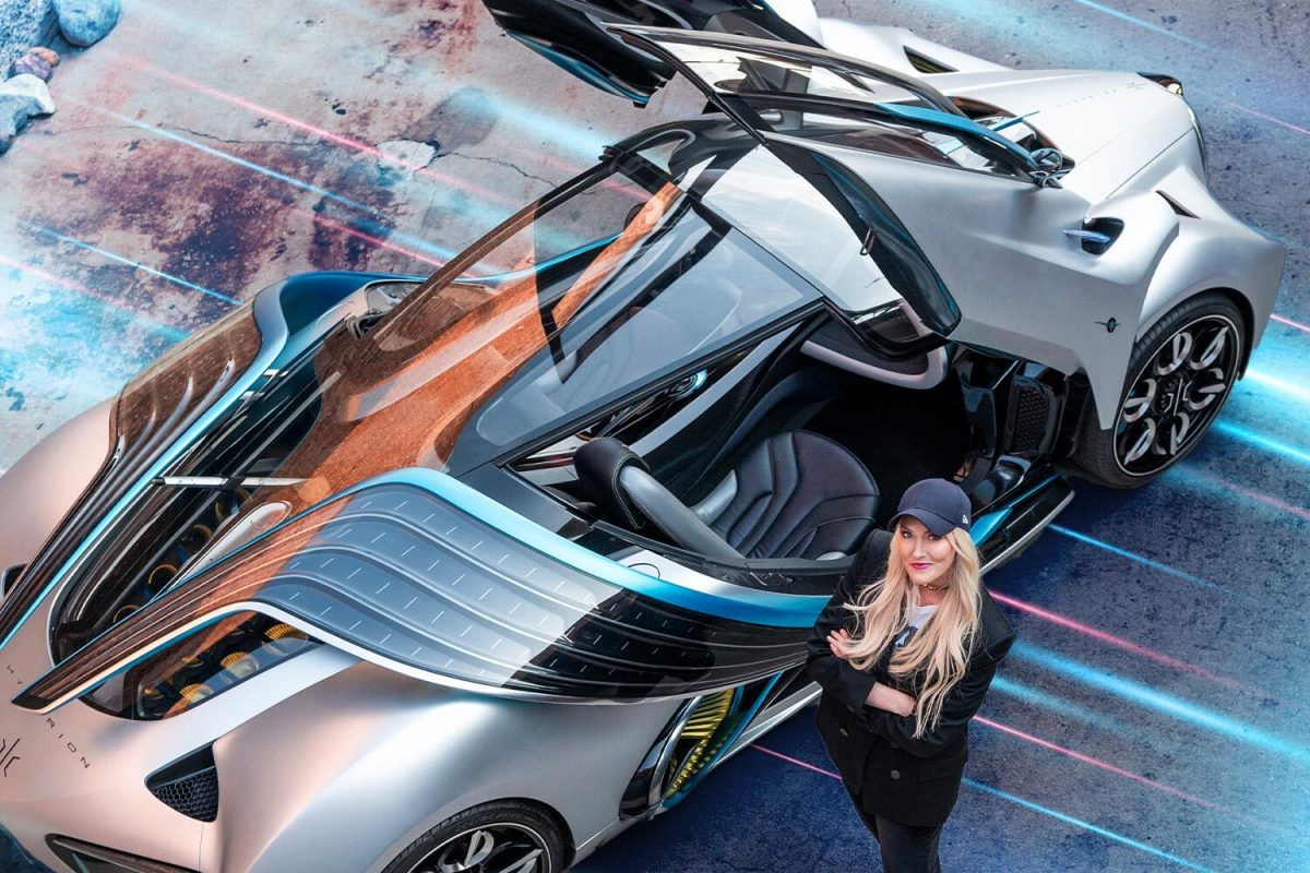 Alex Hirschi, better known online as automotive influencer Supercar Blondie, standing next to the Hyperion XP-1 prototype that will be sold on her new SBX Cars auction site