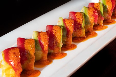 A sushi roll on a plate at Tanoshii, one of the best sushi restaurants in Chicago, Illinois