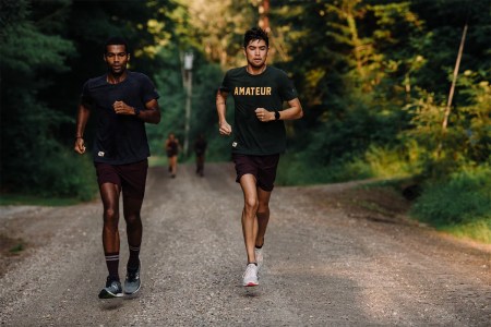 Runners in Tracksmith gear on a woodland trail. Here's how to take advantage of the brand's PR Bonus program.