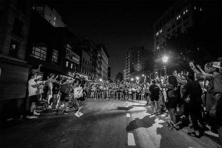 A group of runners lined up at the start of a Take The Bridge race in New York City. Here's the story behind Darcy Budworth's unsanctioned racing series.