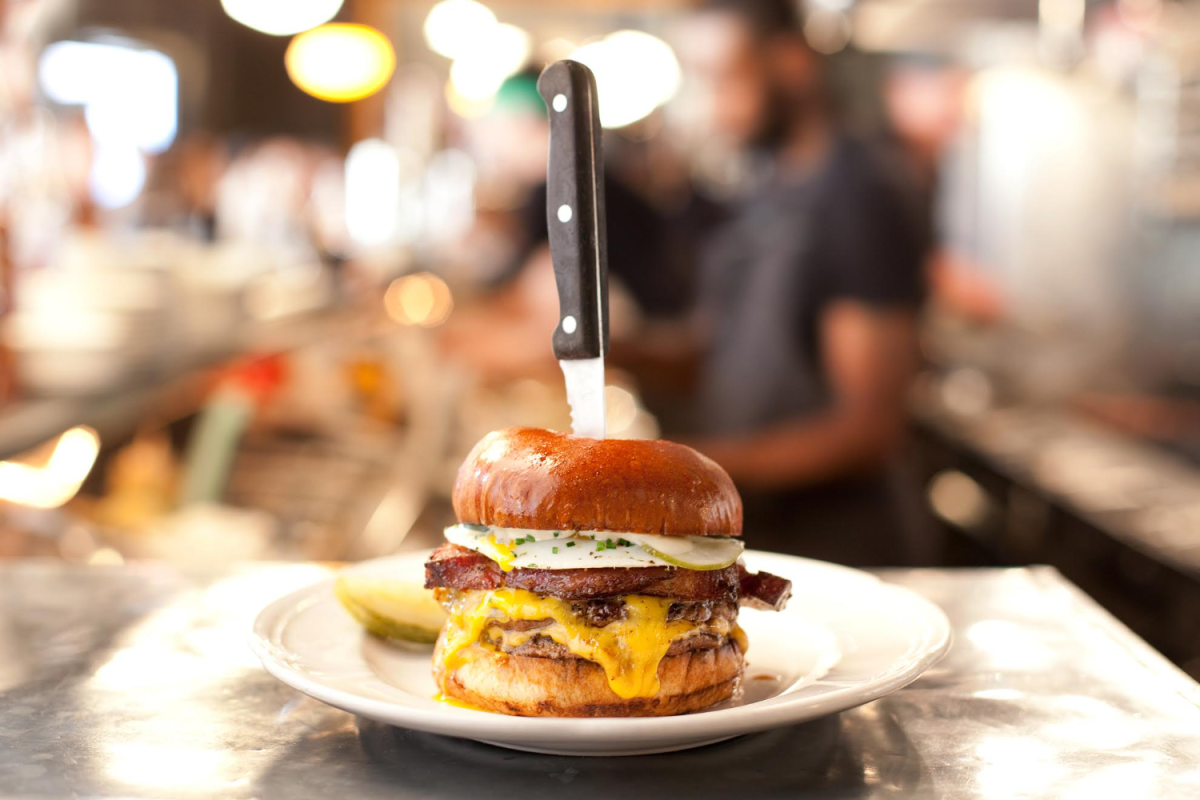 burger with knife stabbing through the middle