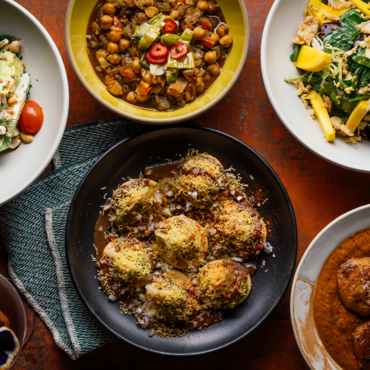 A spread of vegan food from Besharam in San Francisco, one of the best restaurants for vegans in the city