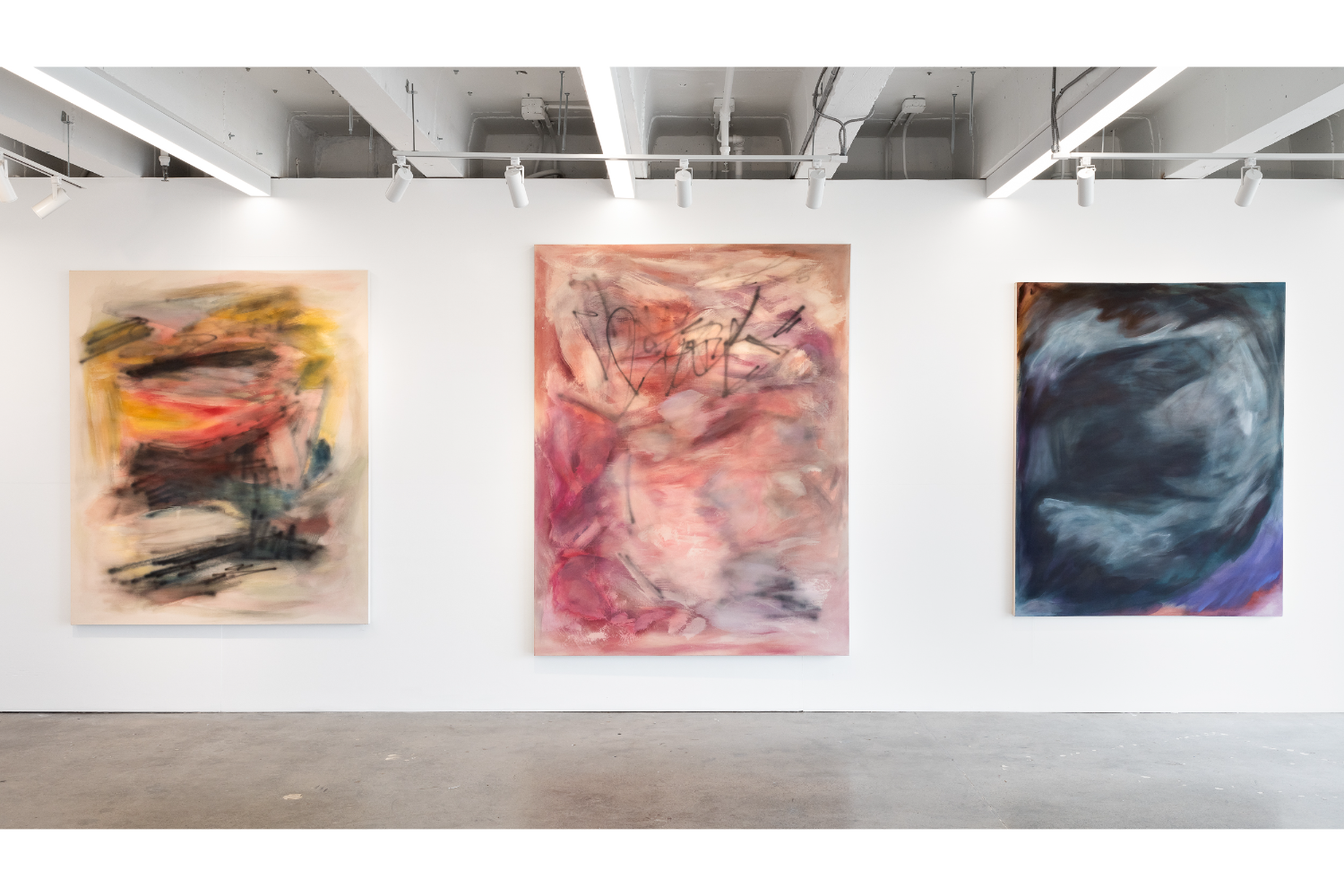 three large paintings, orange and yellow (left), pink (middle), dark blue and gray (right)