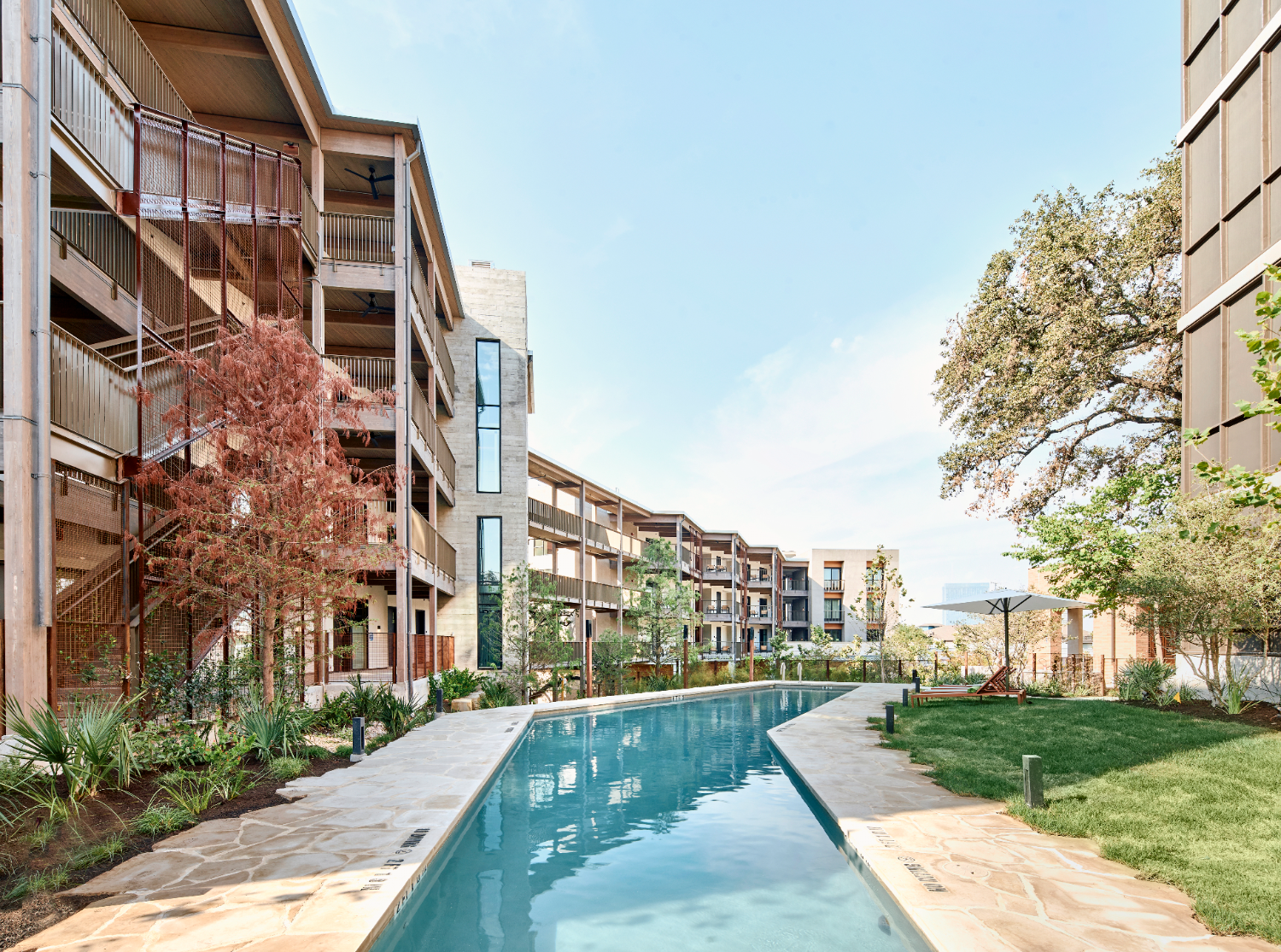 pool in between buildings and trees