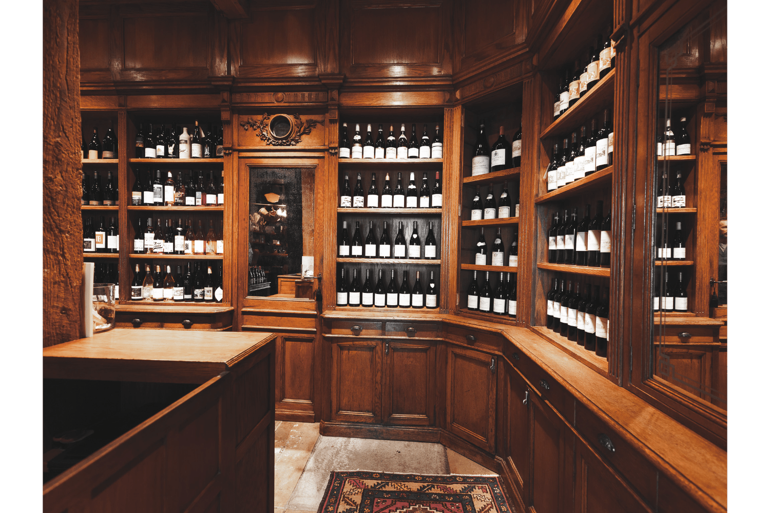 wooden wine cellar with wine bottles